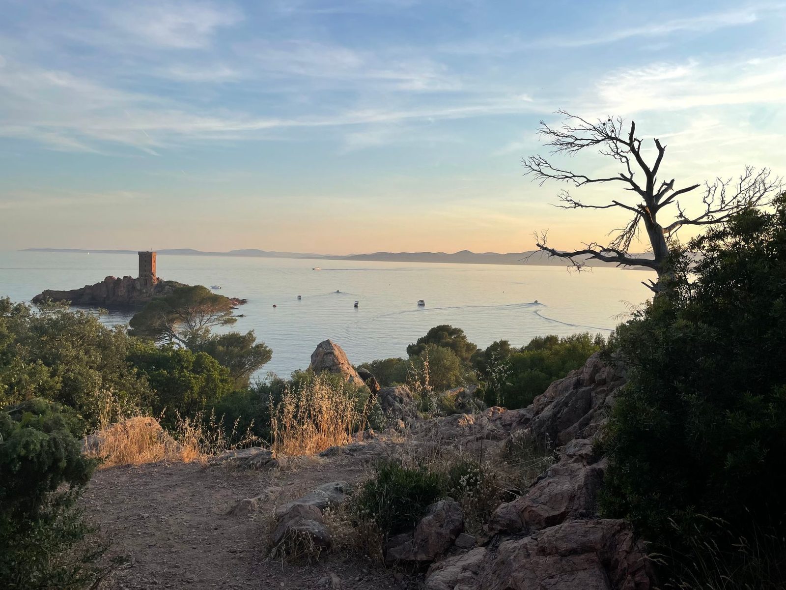 Stunning sunset over the Dramont coastline with sea and island views in Provence, France.