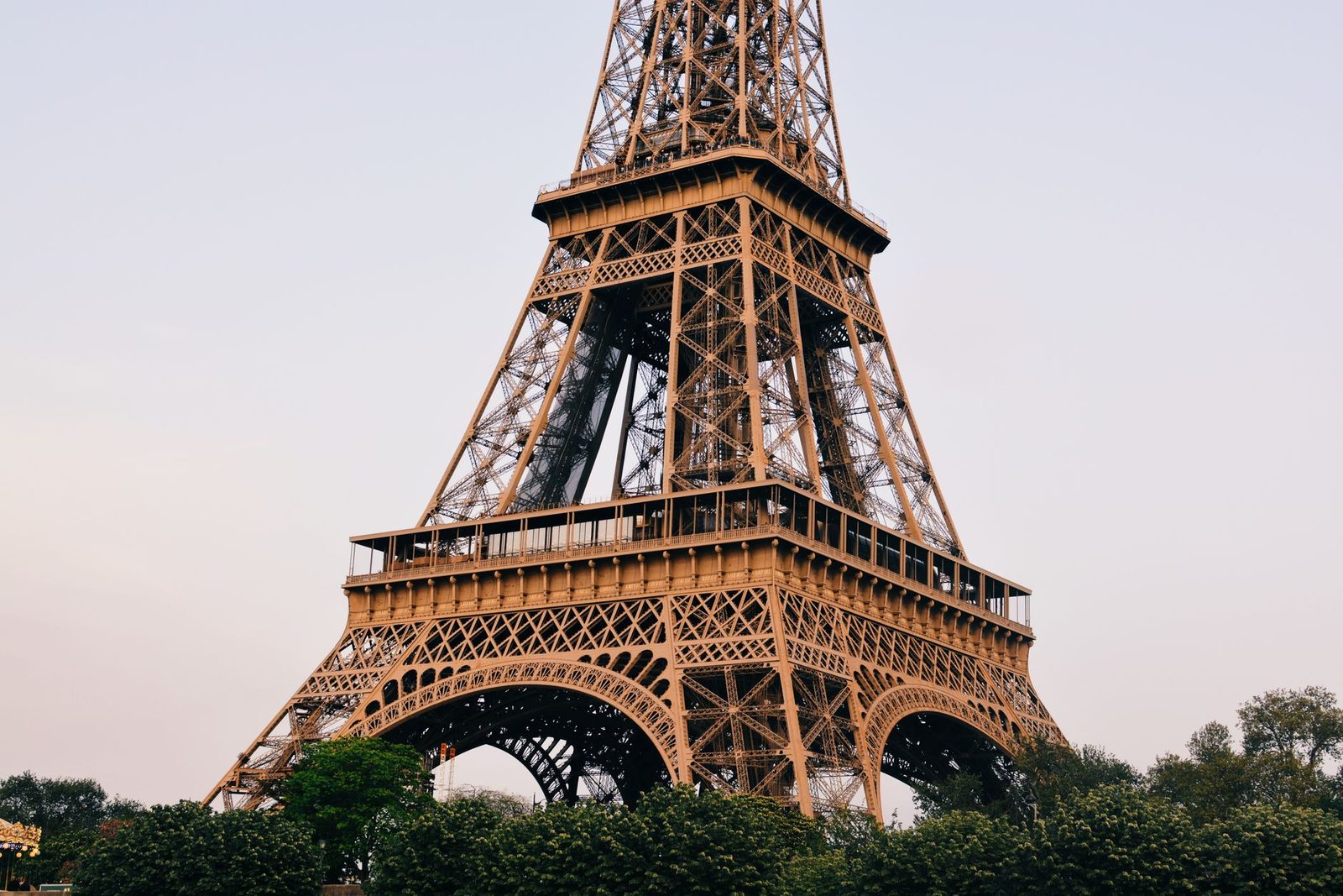 The Eiffel Tower's iconic structure in Paris captured on a clear day, showcasing its impressive iron lattice design.