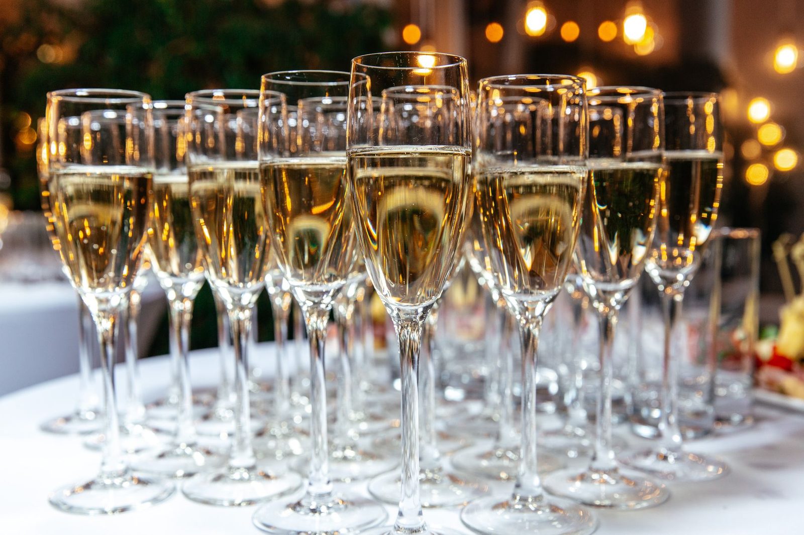 A festive arrangement of sparkling wine glasses on a table, perfect for celebrations and events.