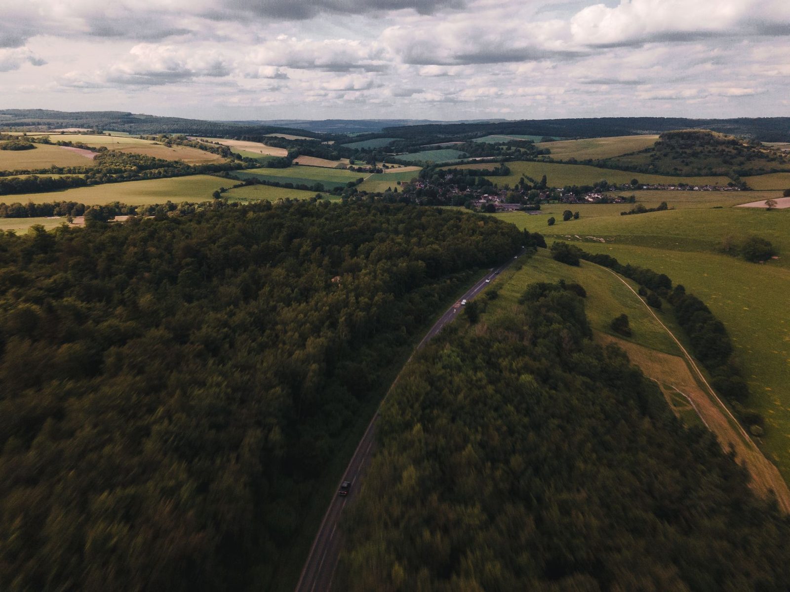 A stunning aerial view of the rolling hills and fields in West Sussex, England.