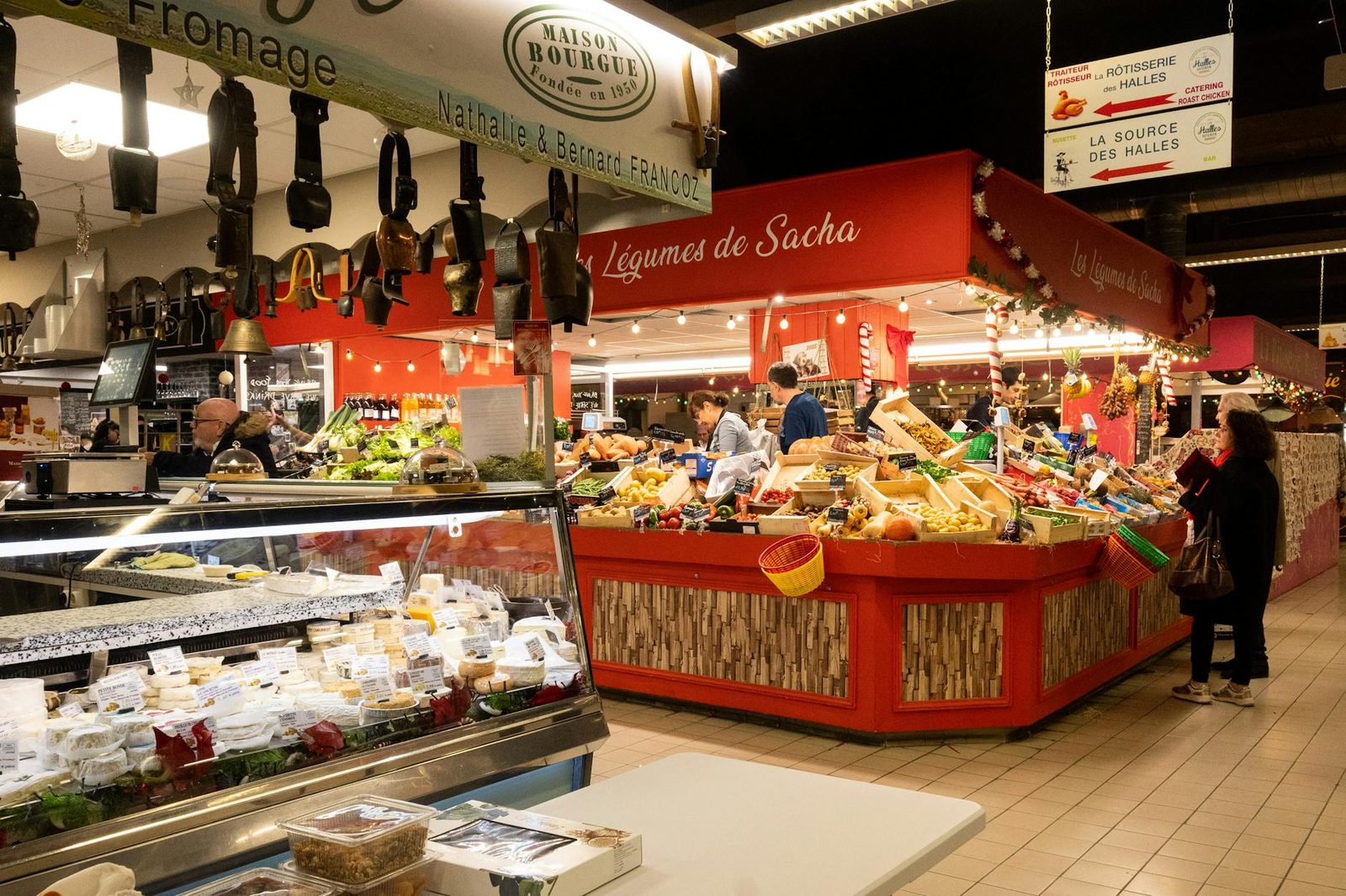Bustling indoor market scene in Avignon, capturing diverse stalls and vibrant produce.