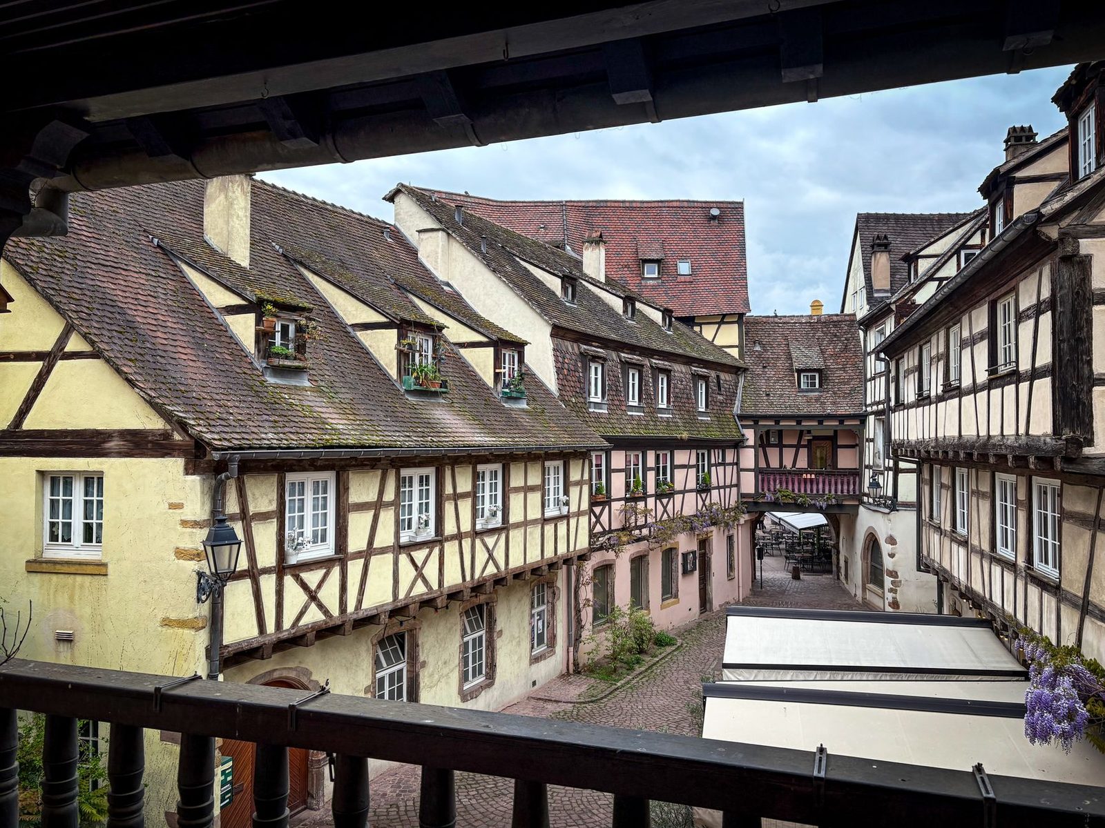 Explore the charming medieval architecture of a picturesque French town with cobblestone streets and half-timbered houses.